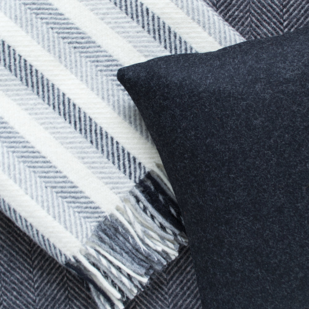 Tweedmill wool blanket throw & Abraham Moon black wool cushion made in UK