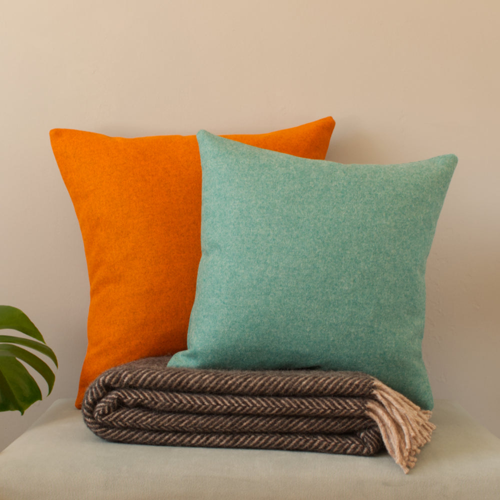 Turquoise & Orange Wool Cushions made in UK with Abraham Moon natural & sustainable wool